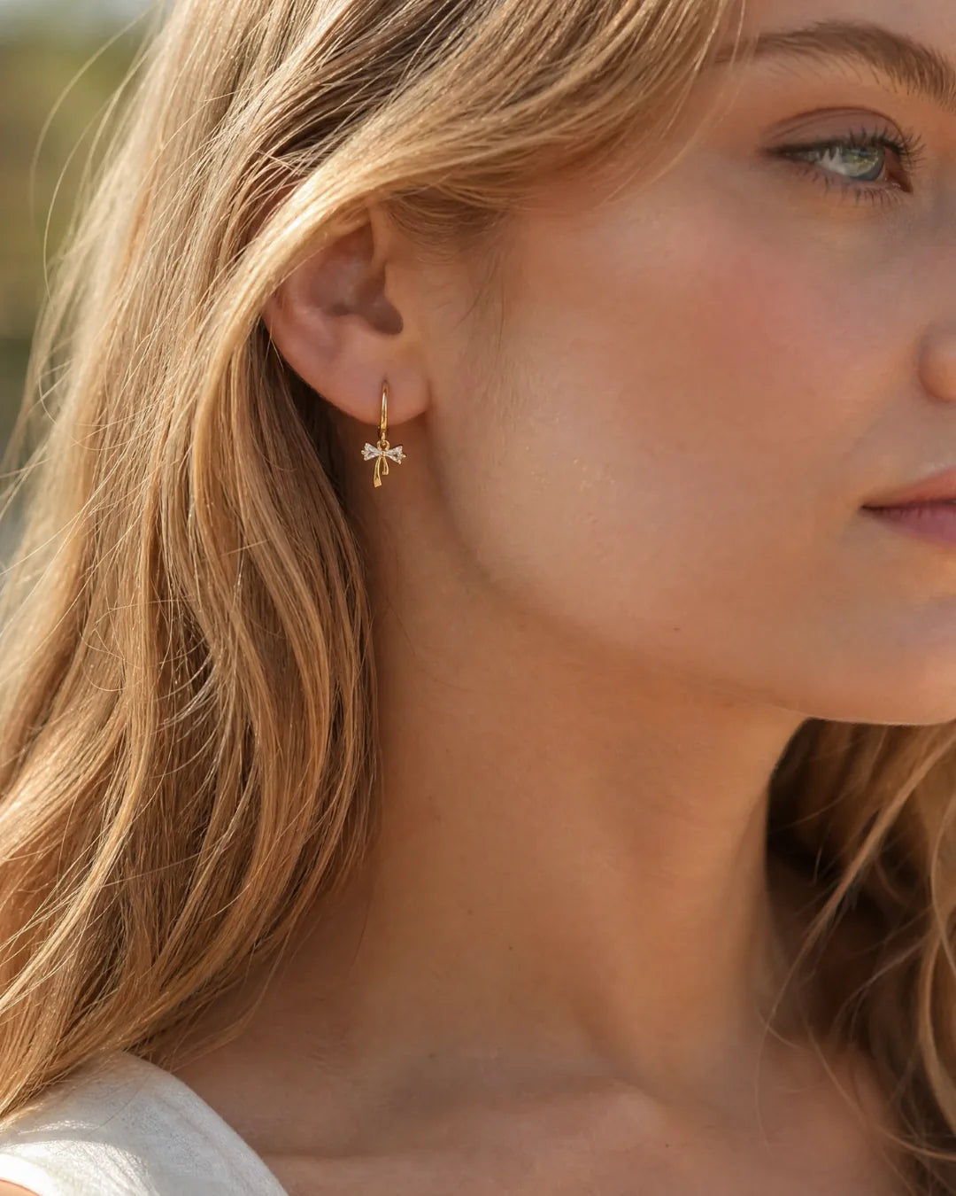 Celina Bow Huggie Earrings Lavish